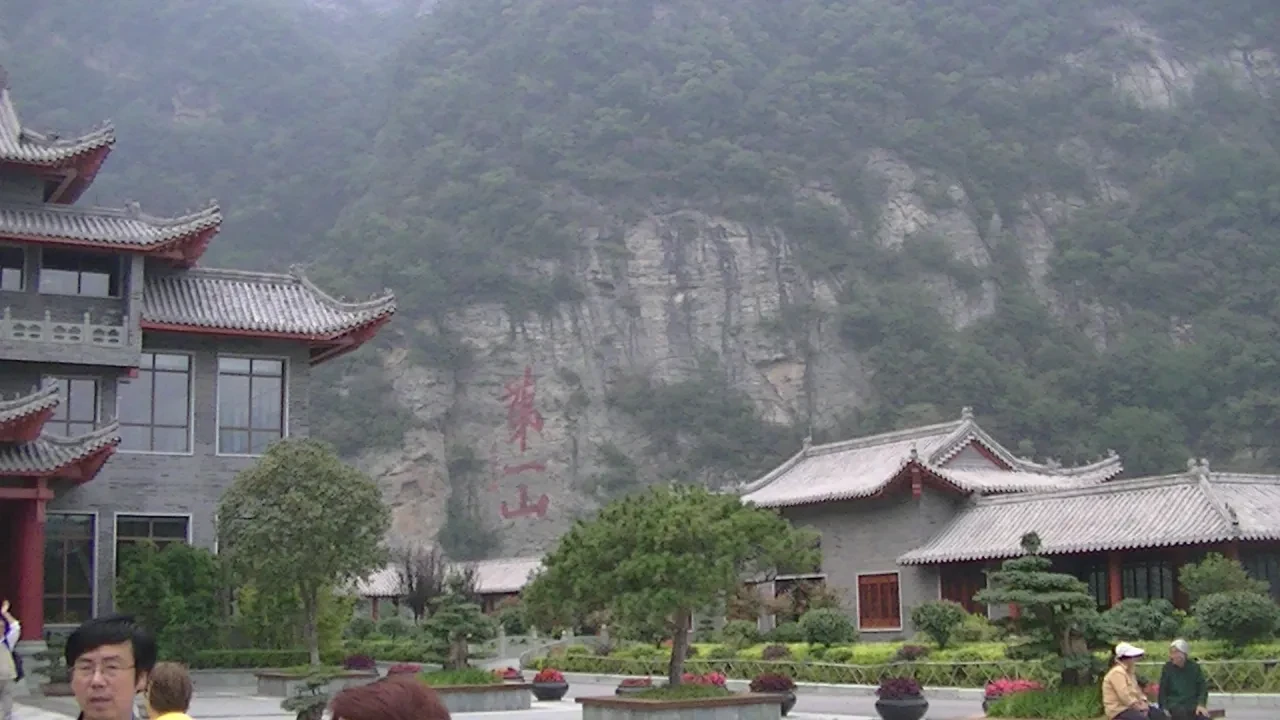 Wudang Mountain temple complex with Chinese characters on cliff face