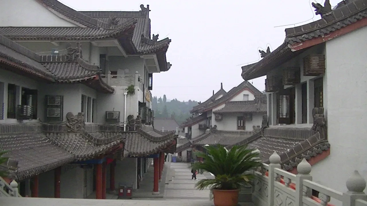 Traditional Chinese street with grey-tiled rooftops and stone balustrades
