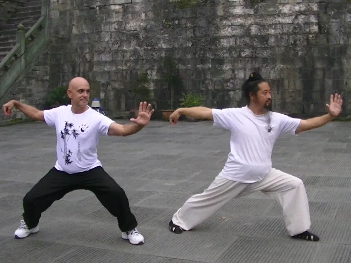 Tony Garcia and a Wudang master practicing Tai Chi together at the temple courtyard