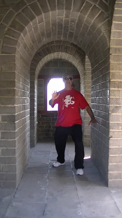 Tony Garcia inside a brick tunnel on the Great Wall